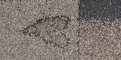 Heart Shaped Defect on an Atlas Chalet Shingle